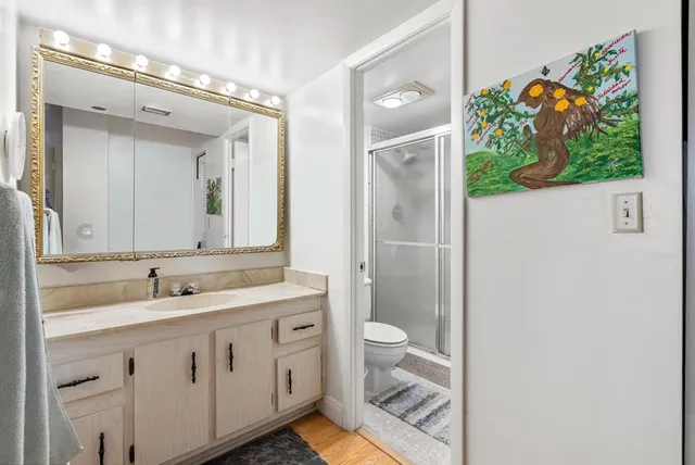 a bathroom with a sink a vanity and a mirror