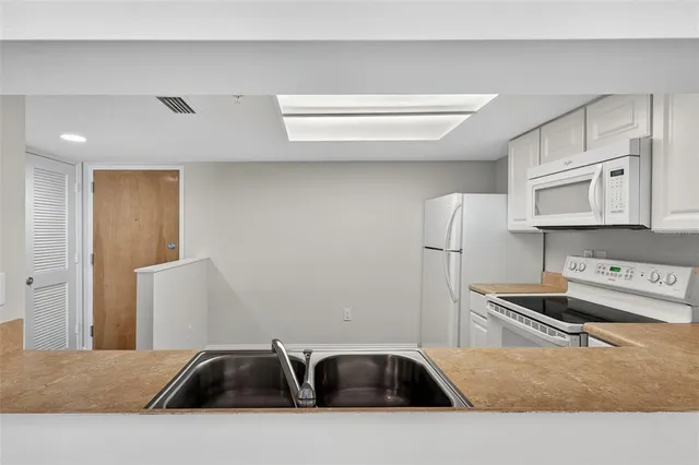 a room with a chair and wooden floor