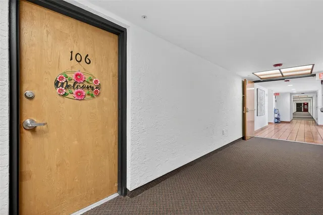 a kitchen with a white cabinets and white appliances