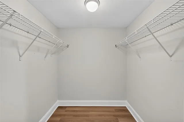 a view of an empty room with glass door