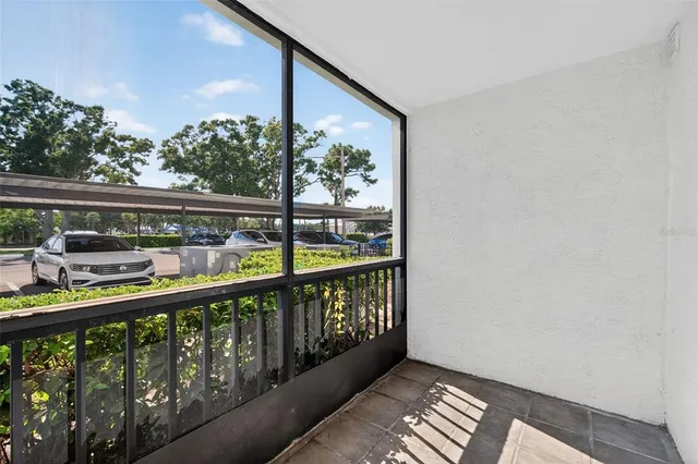 a balcony view with a glass door