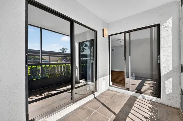 a view of a swimming pool with lounge chairs