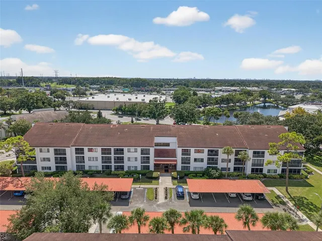 an aerial view of residential houses with outdoor space and street view
