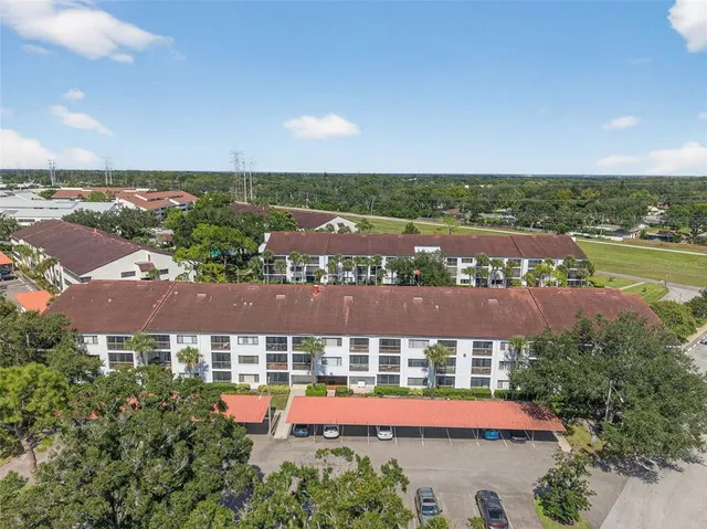 an aerial view of a house with a yard and garden