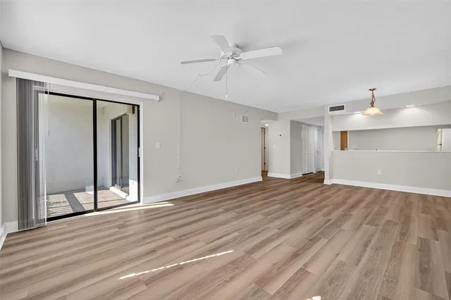 a bathroom with a toilet sink a shower and a mirror