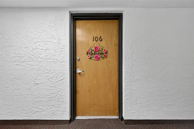 a view of a kitchen with a closet and electronic appliances