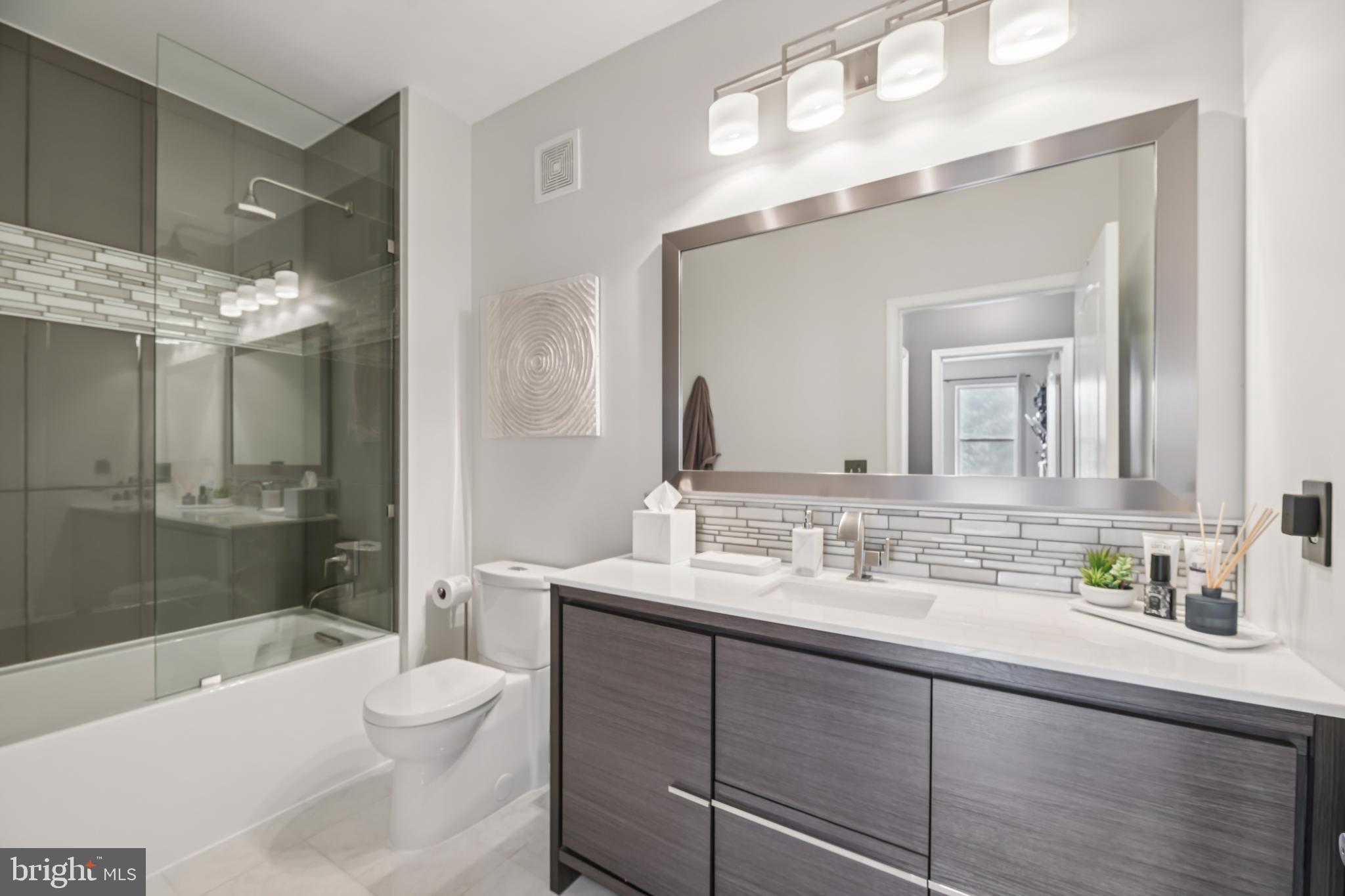 1621 Ladue Court, Unit 207 Woodbridge, VA 22191 - Photo 15 of 33 a bathroom with a sink a toilet and shower