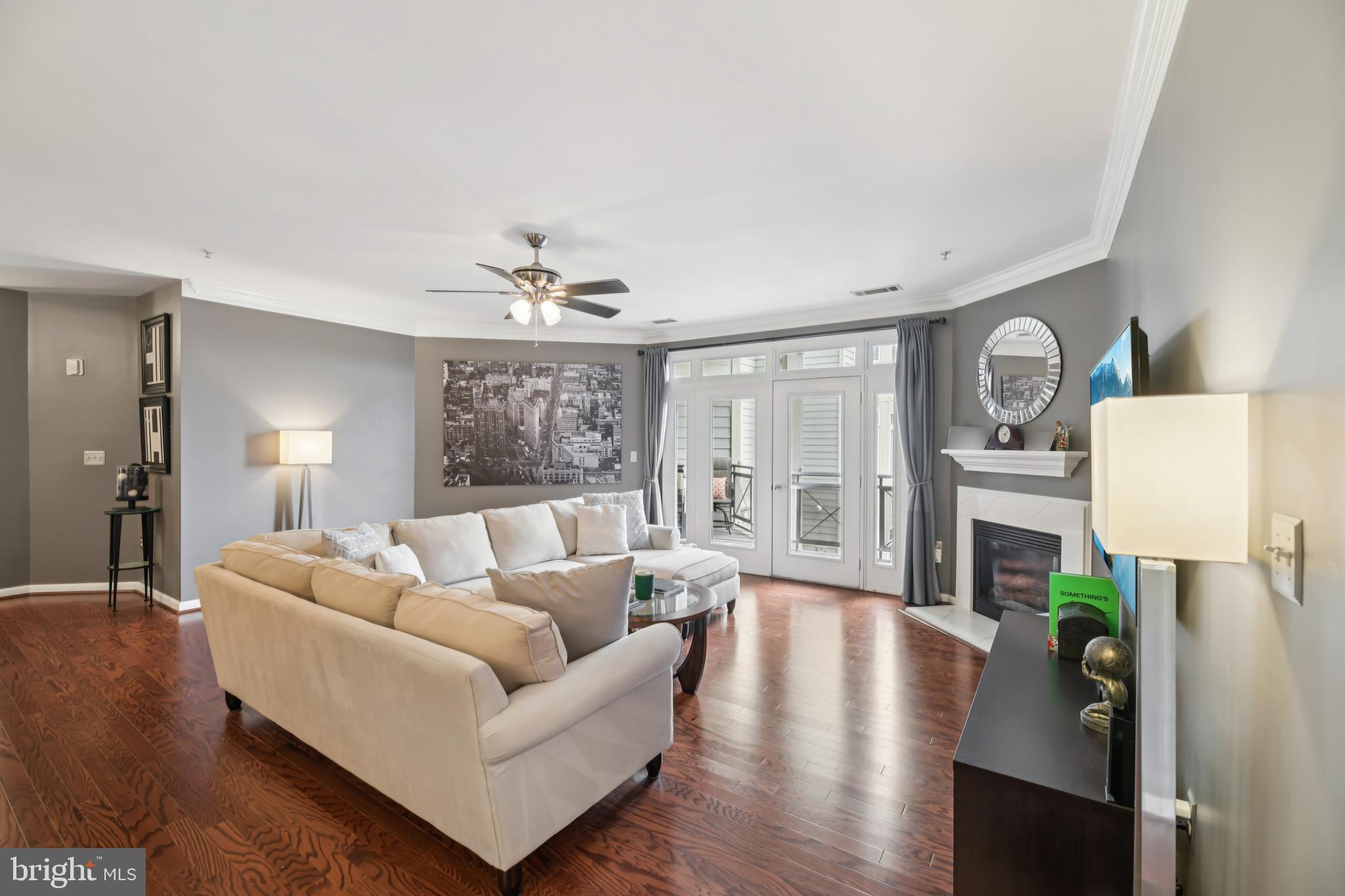 1621 Ladue Court, Unit 207 Woodbridge, VA 22191 - Photo 2 of 33 a living room with furniture and a large window