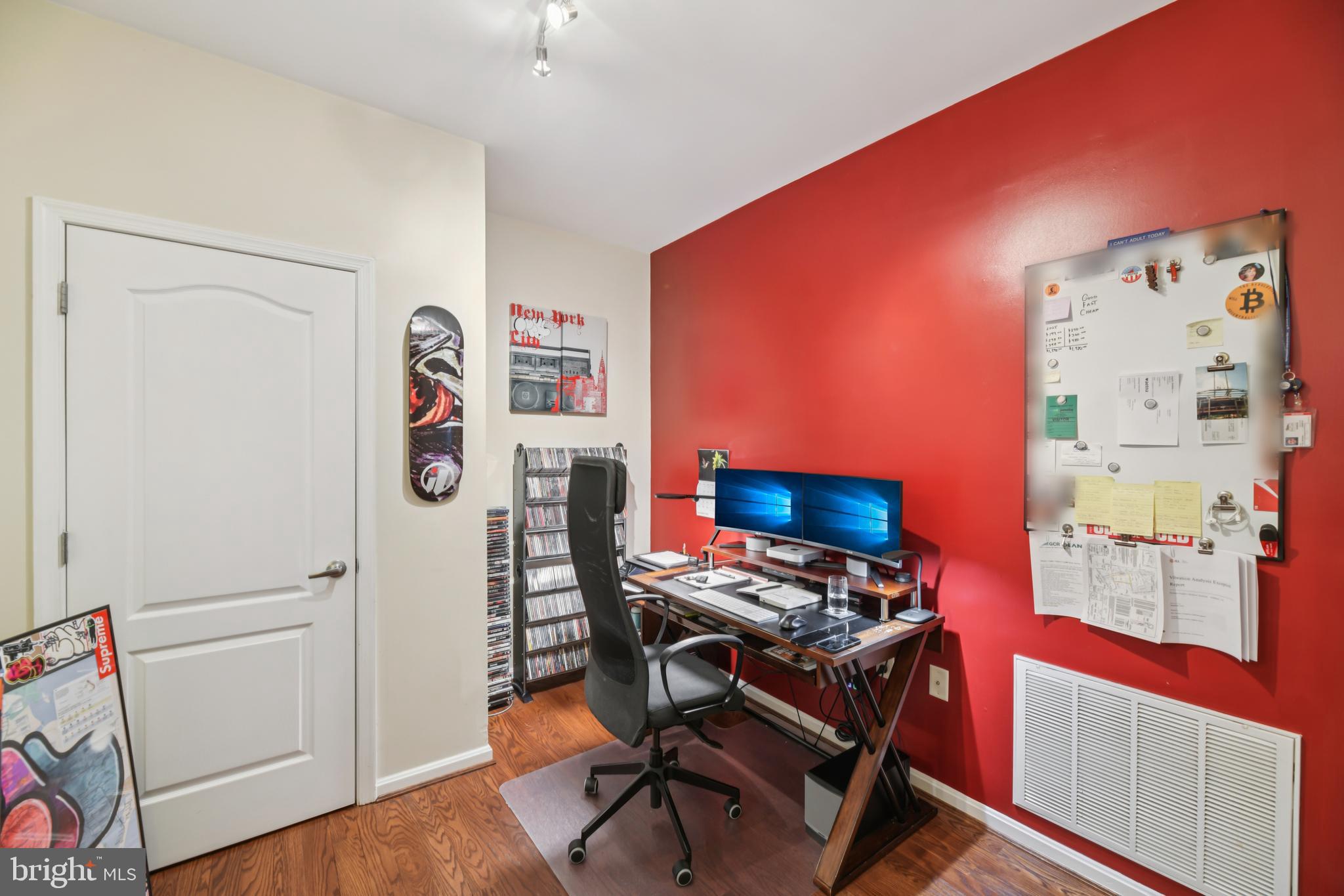 1621 Ladue Court, Unit 207 Woodbridge, VA 22191 - Photo 24 of 33 a workspace with furniture and wooden floor