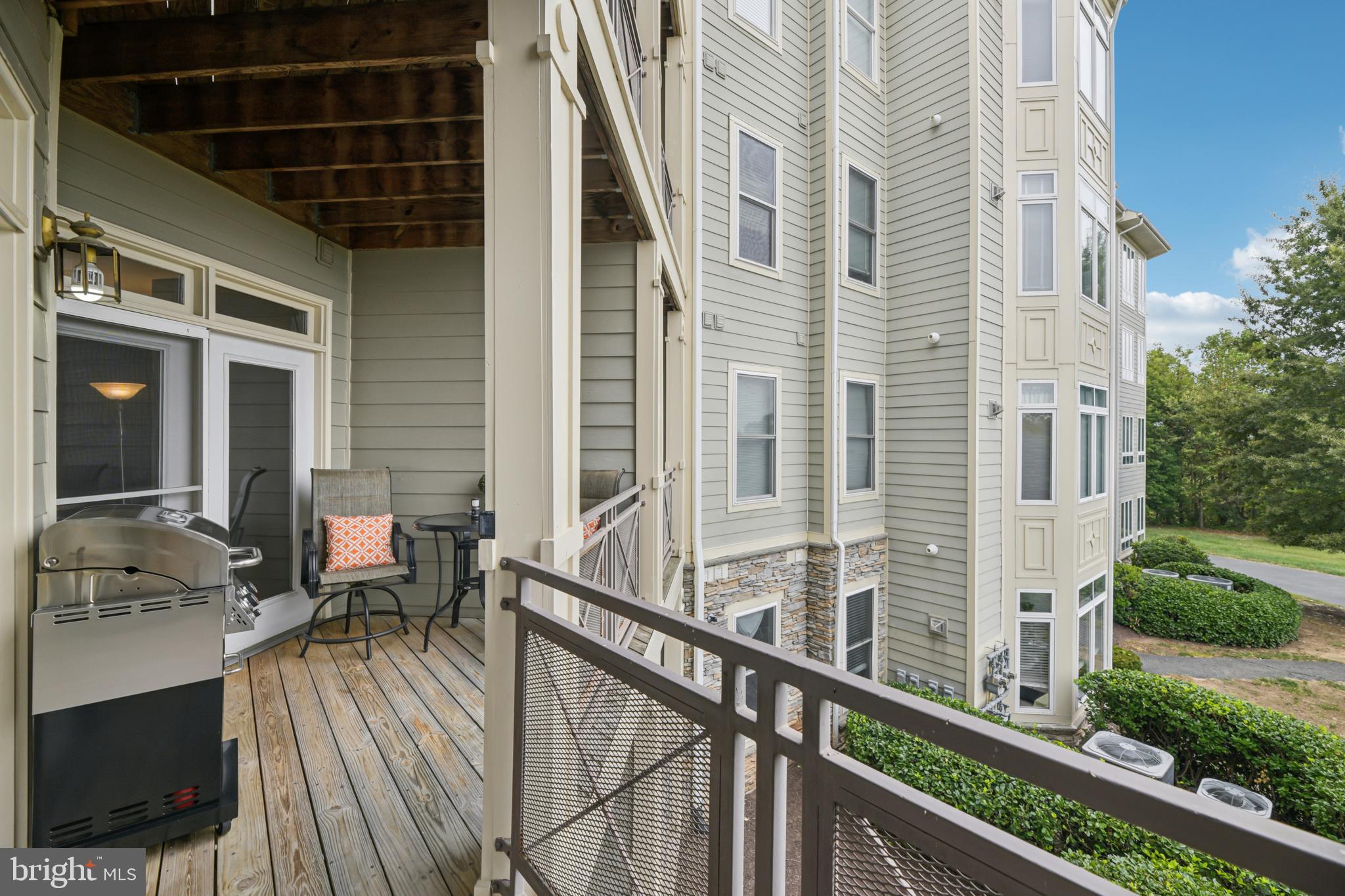 1621 Ladue Court, Unit 207 Woodbridge, VA 22191 - Photo 27 of 33 a view of a balcony with chairs and wooden floor