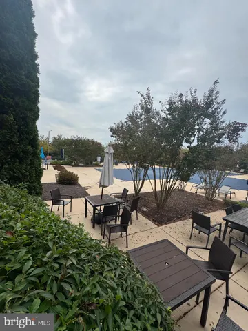 a view of a backyard with sitting area