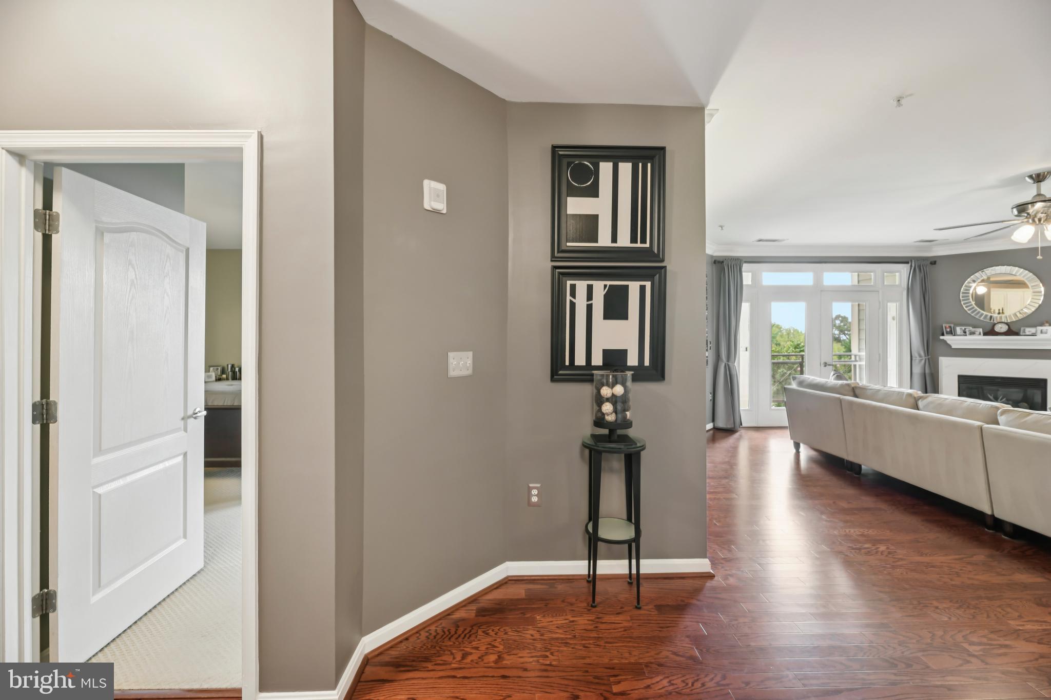 1621 Ladue Court, Unit 207 Woodbridge, VA 22191 - Photo 6 of 33 a view of a room with wooden floor and windows