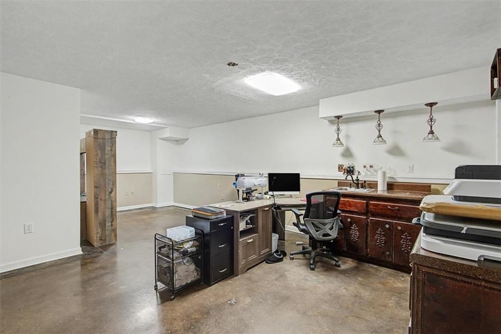 409 Windsor Way Canton, GA 30115 - Photo 26 of 51 a view of a workspace with furniture