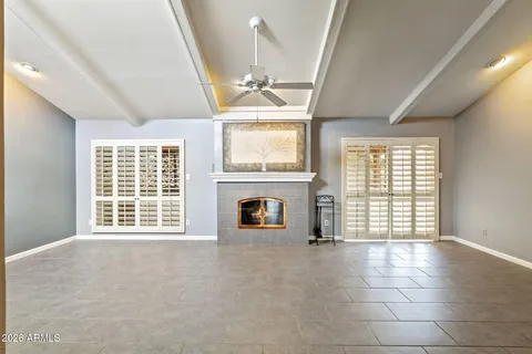 a kitchen with granite countertop a sink stove and cabinets