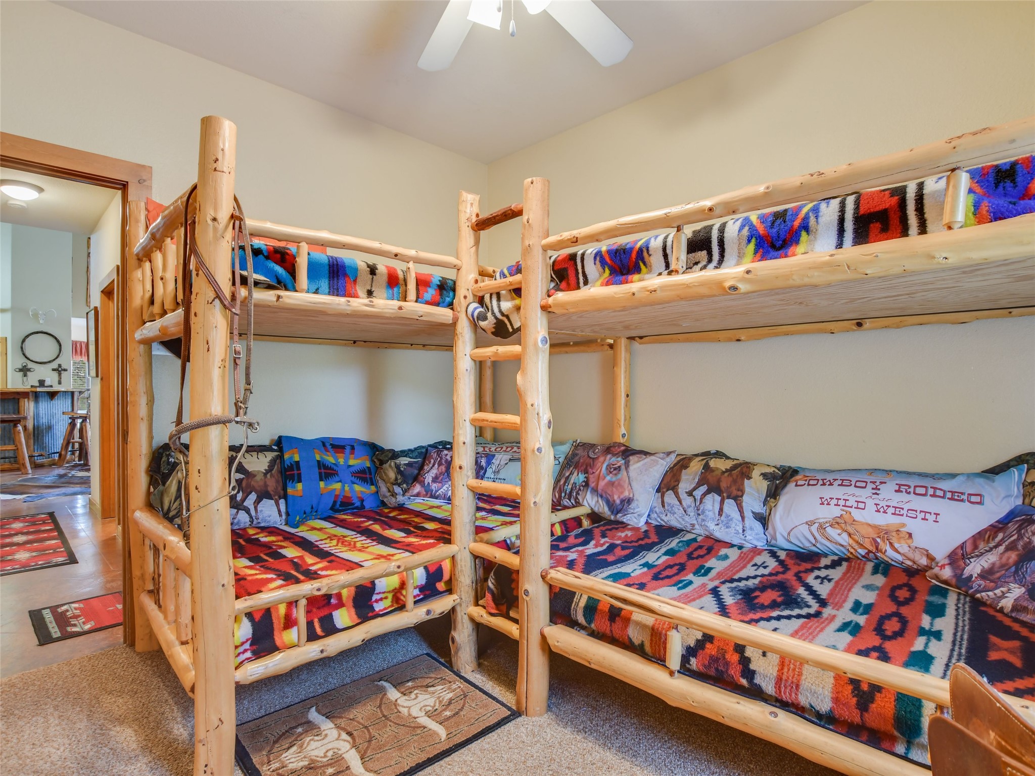 762 Karisch Road Smithville, TX 78957 - Photo 17 of 40 a bedroom with three beds and a window