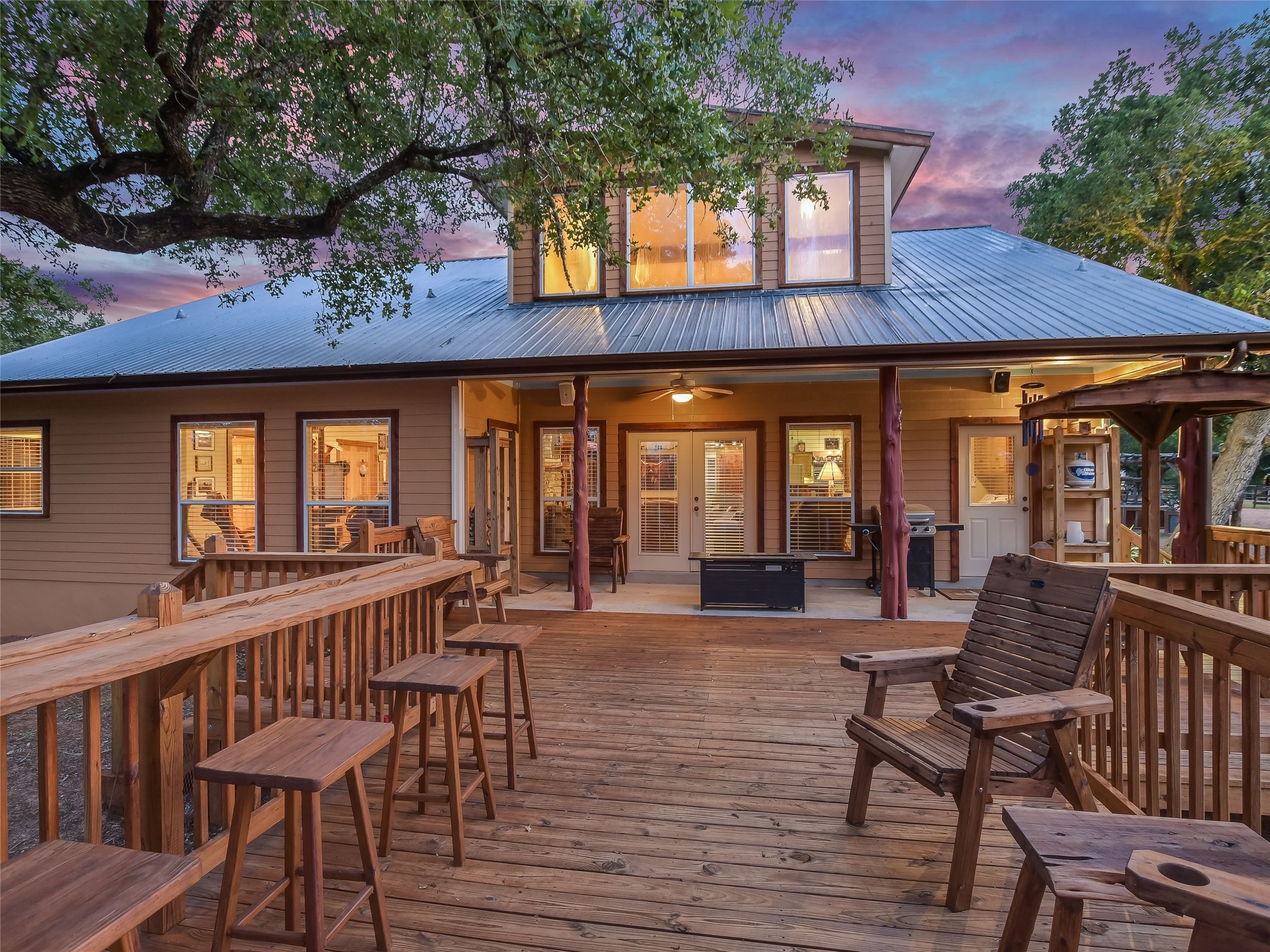 762 Karisch Road Smithville, TX 78957 - Photo 18 of 40 a view of a patio with table and chairs and wooden floor