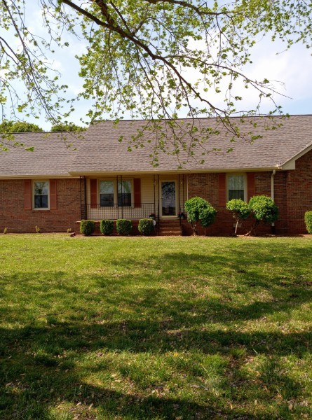 3168 Maxey Road Cedar Hill, TN 37032 - Photo 3 of 40 a front view of a house with a garden