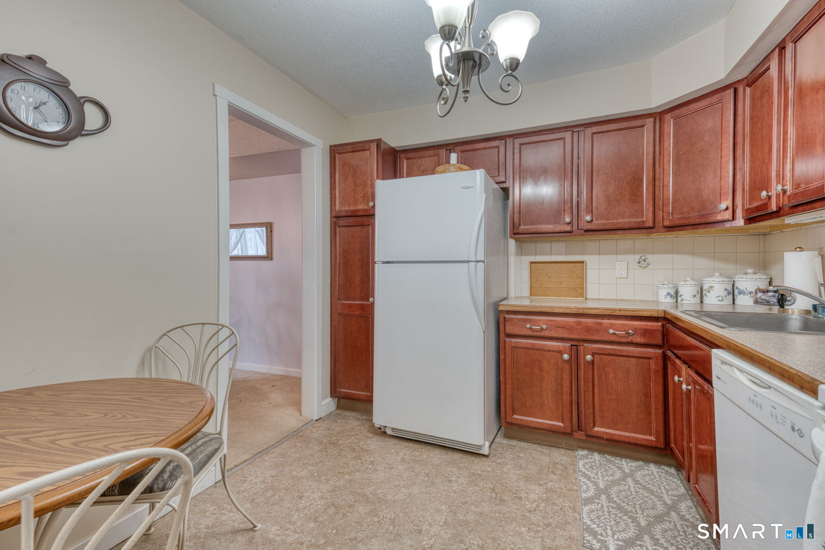 40 Hickory Hill Road, Unit 40 Southington, CT 06489 - Photo 11 of 35 a kitchen with a refrigerator and a sink