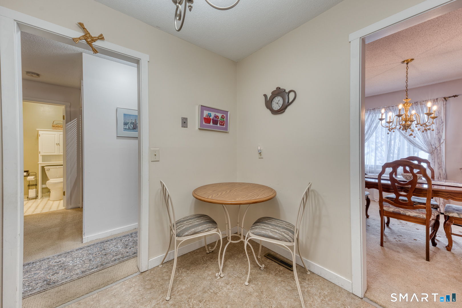 40 Hickory Hill Road, Unit 40 Southington, CT 06489 - Photo 14 of 35 a dining room with furniture and a chandelier fan