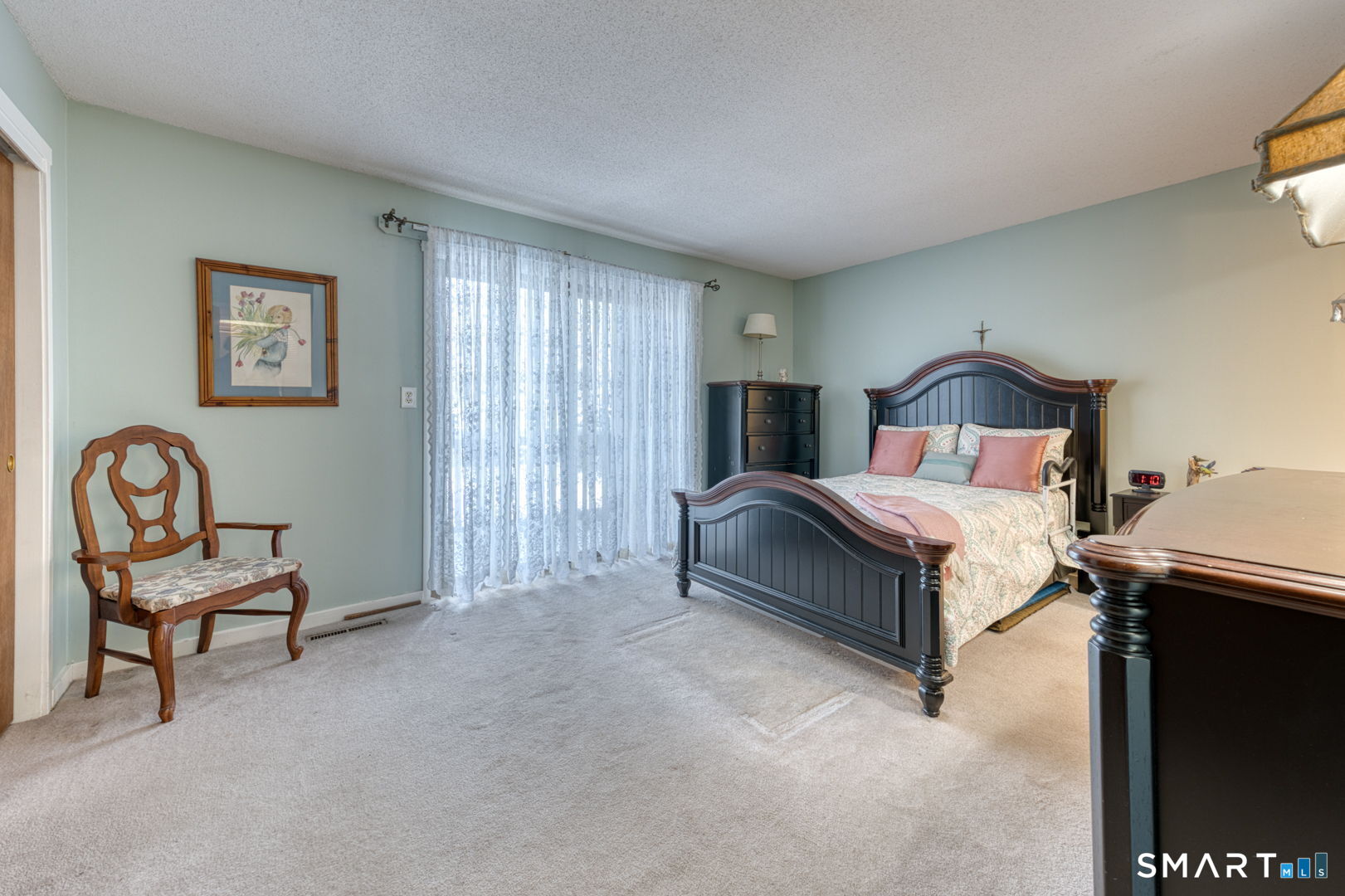 40 Hickory Hill Road, Unit 40 Southington, CT 06489 - Photo 19 of 35 a bedroom with a bed and chair
