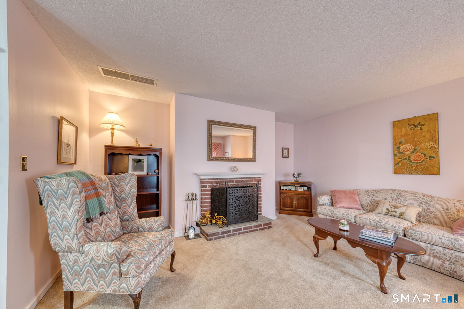 40 Hickory Hill Road, Unit 40 Southington, CT 06489 - Photo 4 of 35 a living room with furniture and a fireplace