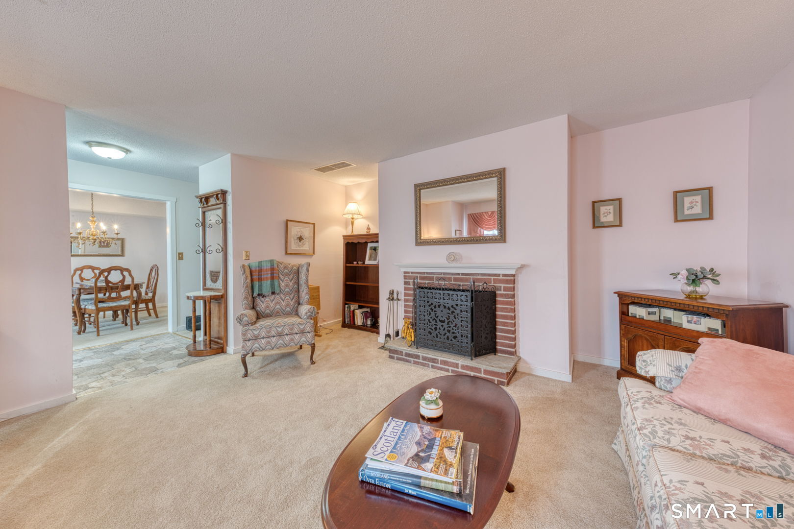 40 Hickory Hill Road, Unit 40 Southington, CT 06489 - Photo 7 of 35 a living room with furniture and a fireplace