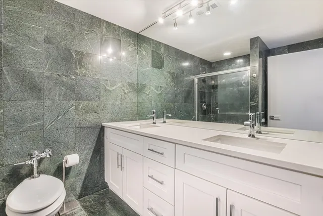 a bathroom with a shower and a sink