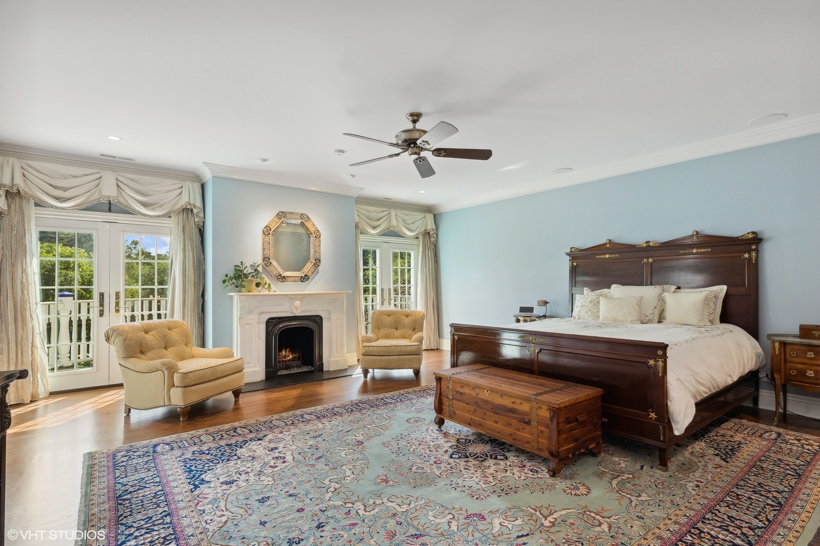 475 West Deerpath Road Lake Forest, IL 60045 - Photo 16 of 35 a spacious bedroom with a bed and a fireplace