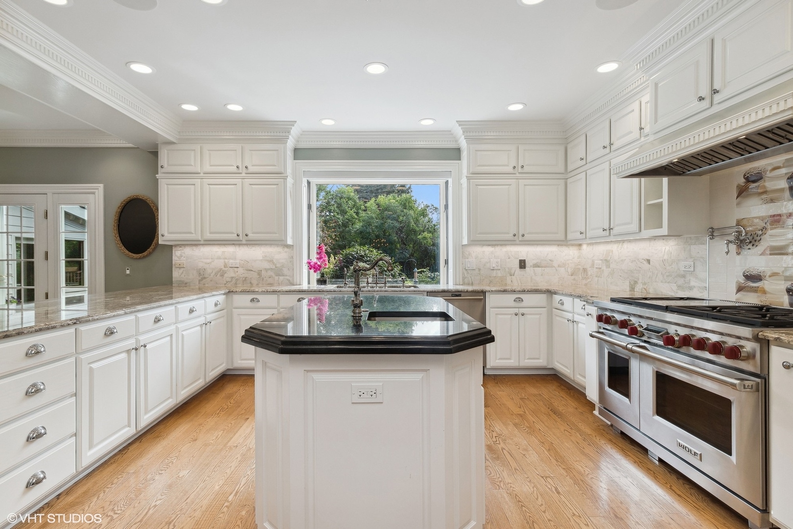 475 West Deerpath Road Lake Forest, IL 60045 - Photo 7 of 35 a kitchen with stainless steel appliances kitchen island granite countertop a sink stove and cabinets