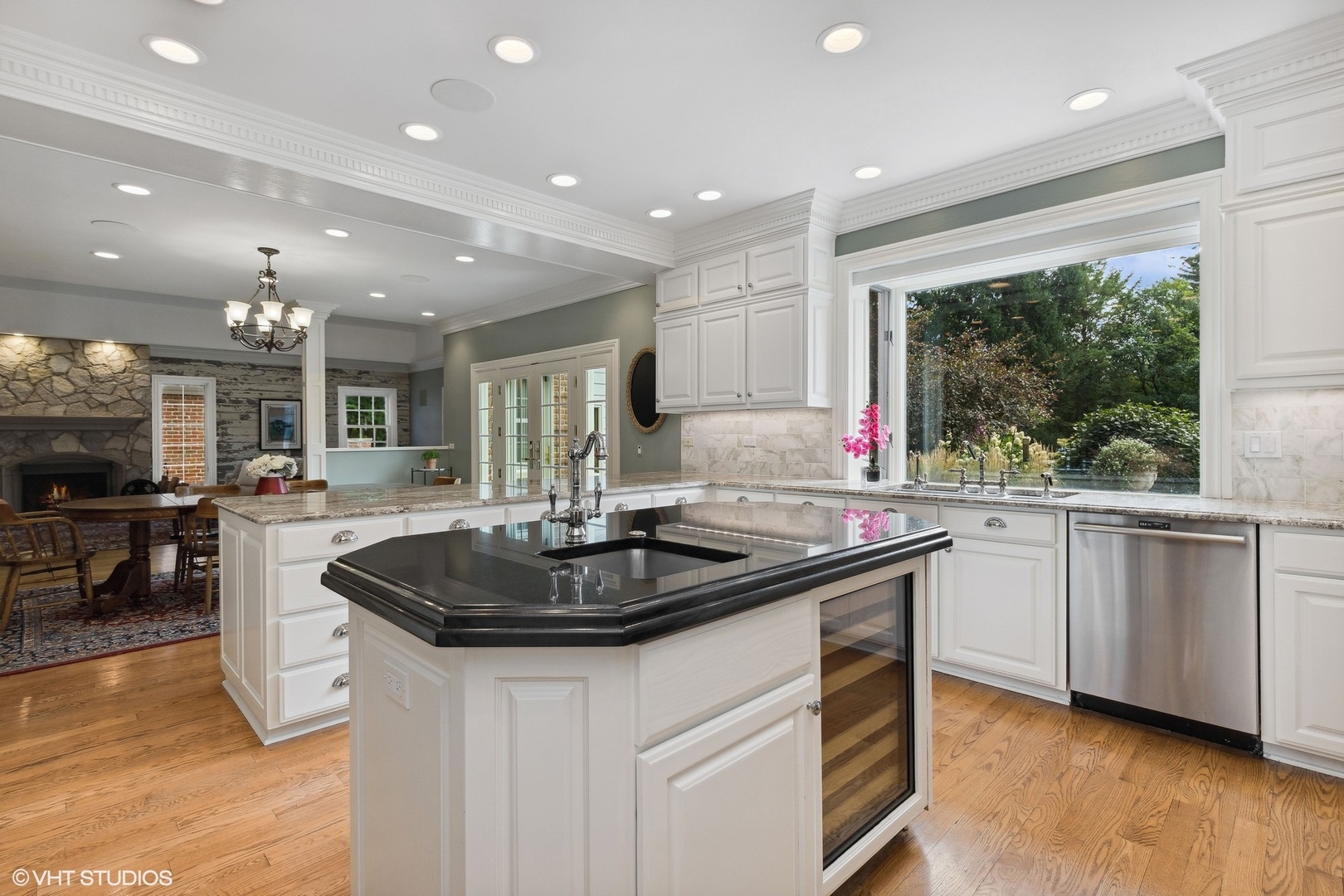 475 West Deerpath Road Lake Forest, IL 60045 - Photo 9 of 35 a kitchen with stainless steel appliances granite countertop a sink a stove and a wooden floors