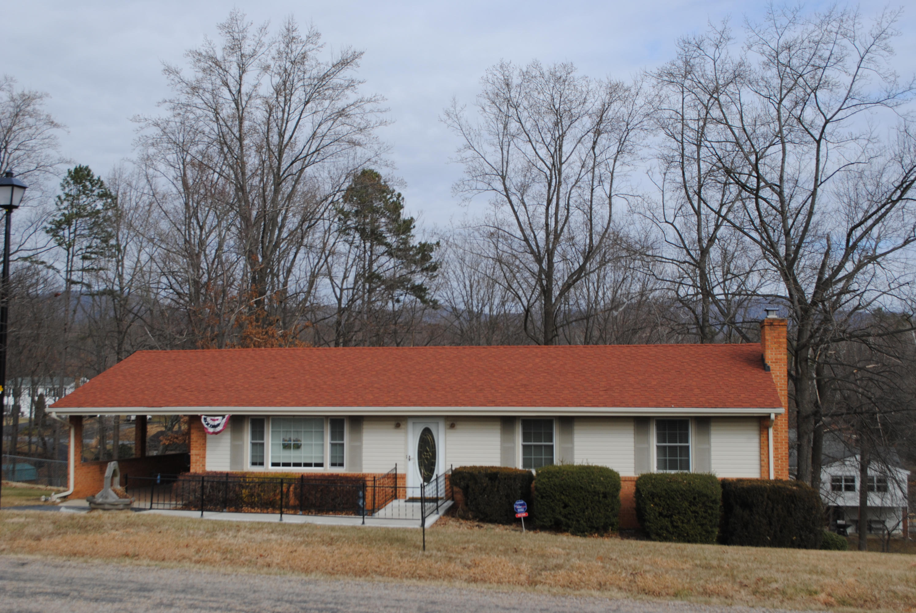 238 Mountain Pass Road Blue Ridge, VA 24064 - Photo 1 of 18 a front view of a house with garden
