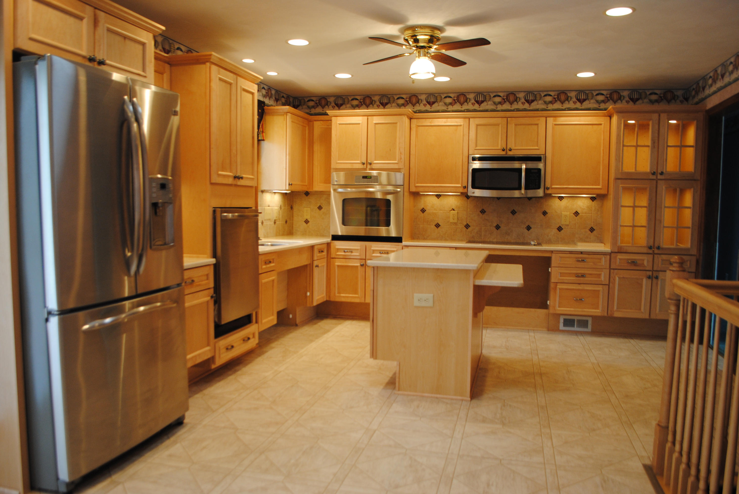 238 Mountain Pass Road Blue Ridge, VA 24064 - Photo 3 of 18 a kitchen with stainless steel appliances a refrigerator and a fireplace