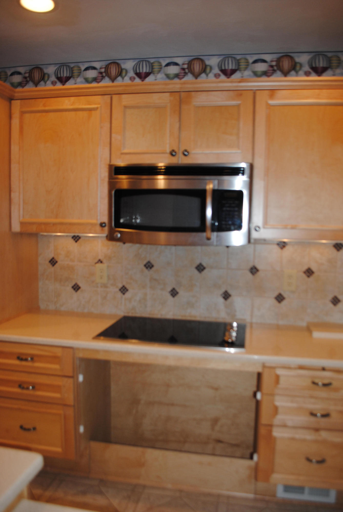 238 Mountain Pass Road Blue Ridge, VA 24064 - Photo 8 of 18 a view of stove and microwave