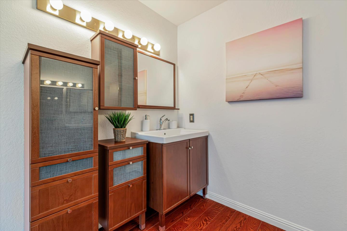 2224 Fazeli Ct. Campbell, CA 95008 - Photo 23 of 36 a bathroom with a sink and a mirror