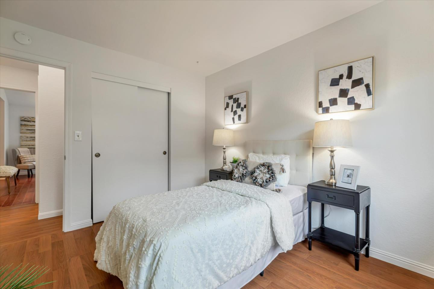 2224 Fazeli Ct. Campbell, CA 95008 - Photo 29 of 36 a bedroom with a bed and a table in it