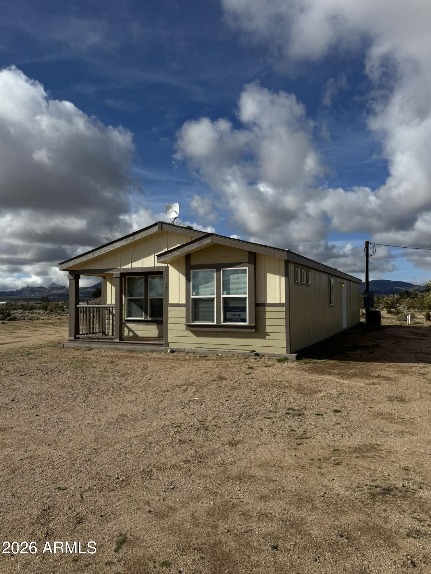 4123 Cowlic Road Golden Valley, AZ 86413 - Photo 3 of 15 a front view of a house with a yard