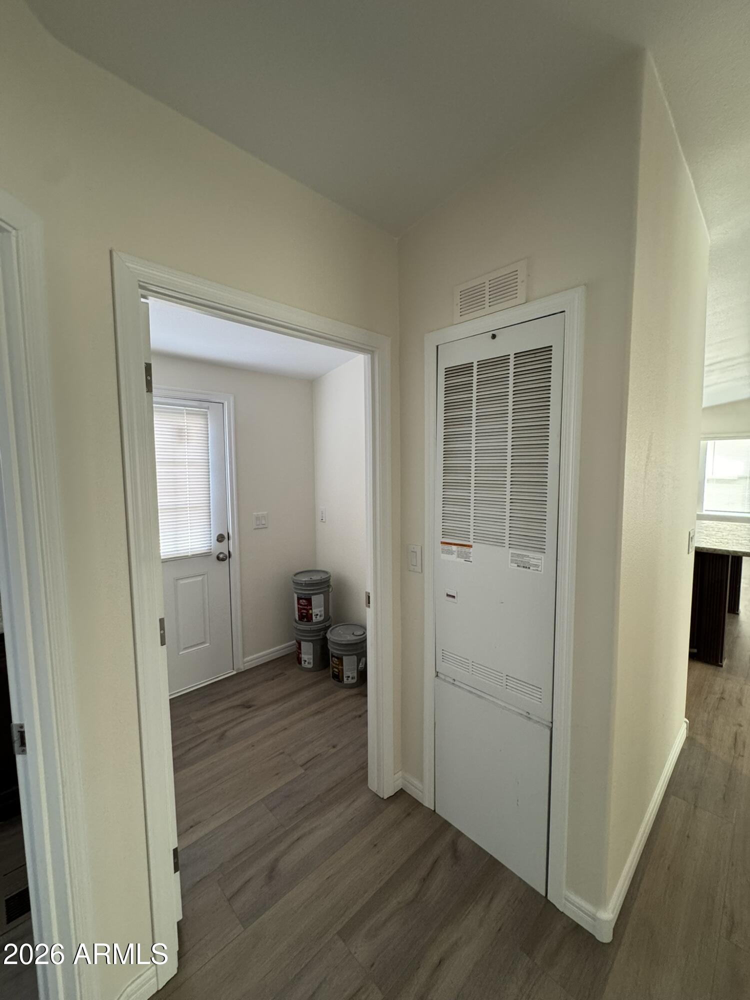 4123 Cowlic Road Golden Valley, AZ 86413 - Photo 8 of 15 an empty room with wooden floor and a bathroom