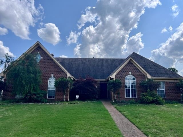 8375 Phillipson Way Memphis, TN 38125 - Photo 1 of 12 a front view of house with yard and green space