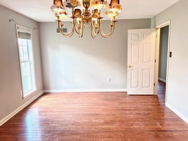 8375 Phillipson Way Memphis, TN 38125 - Photo 7 of 12 a view of a room with wooden floor and windows
