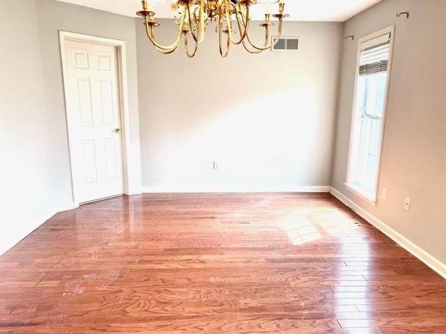 8375 Phillipson Way Memphis, TN 38125 - Photo 8 of 12 a view of empty room with wooden floor