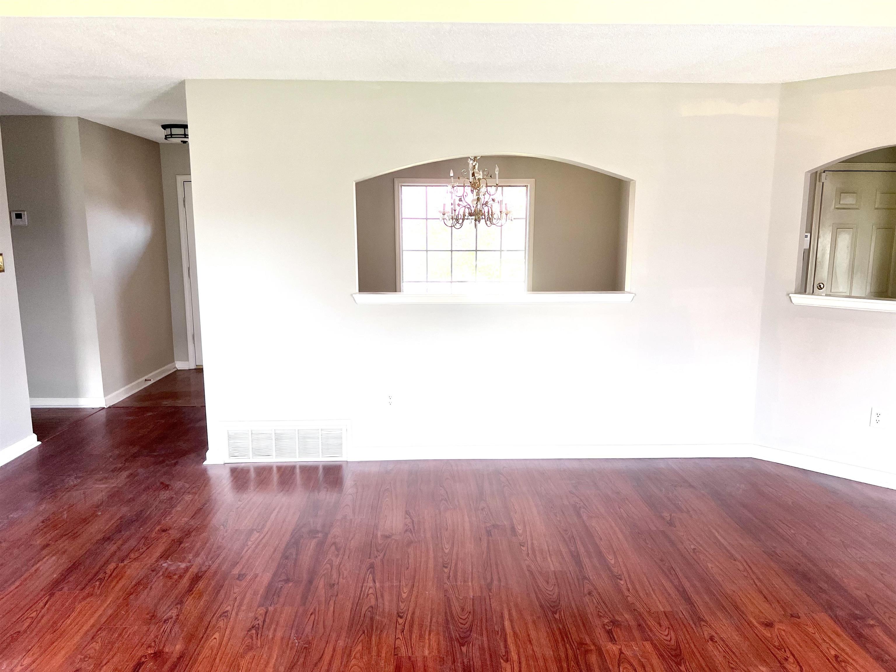 8375 Phillipson Way Memphis, TN 38125 - Photo 10 of 12 a view of a hallway with wooden floor