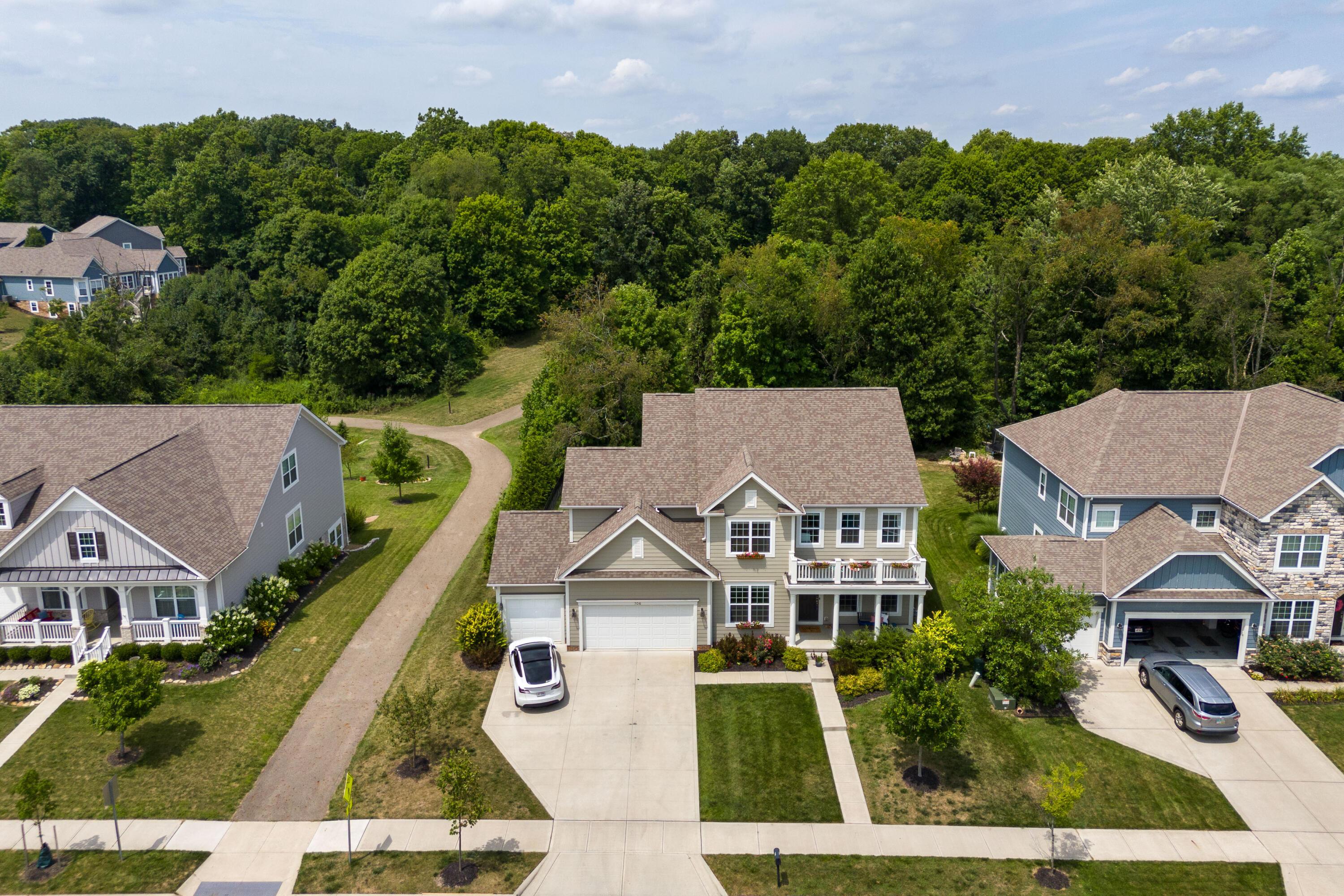 706 Bigham Ridge Boulevard Westerville, OH 43081 - Photo 1 of 62 Look at that view behind this great home! Lots of privacy! Note the Tesla in the driveway - yes, there is a garage charger!