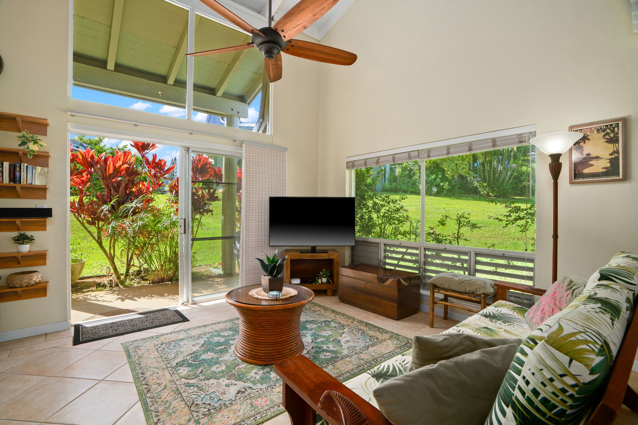 3880 Wyllie Road, Unit 20A Princeville, HI 96722 - Photo 25 of 28 a living room with furniture and a flat screen tv