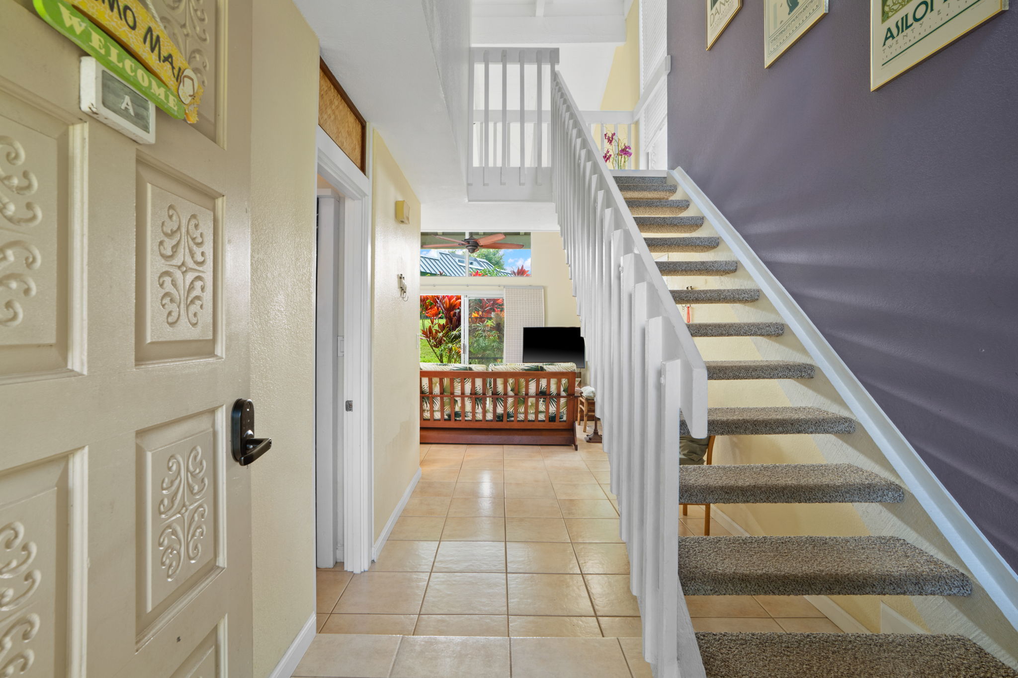 3880 Wyllie Road, Unit 20A Princeville, HI 96722 - Photo 27 of 28 a view of entryway and hall with wooden floor