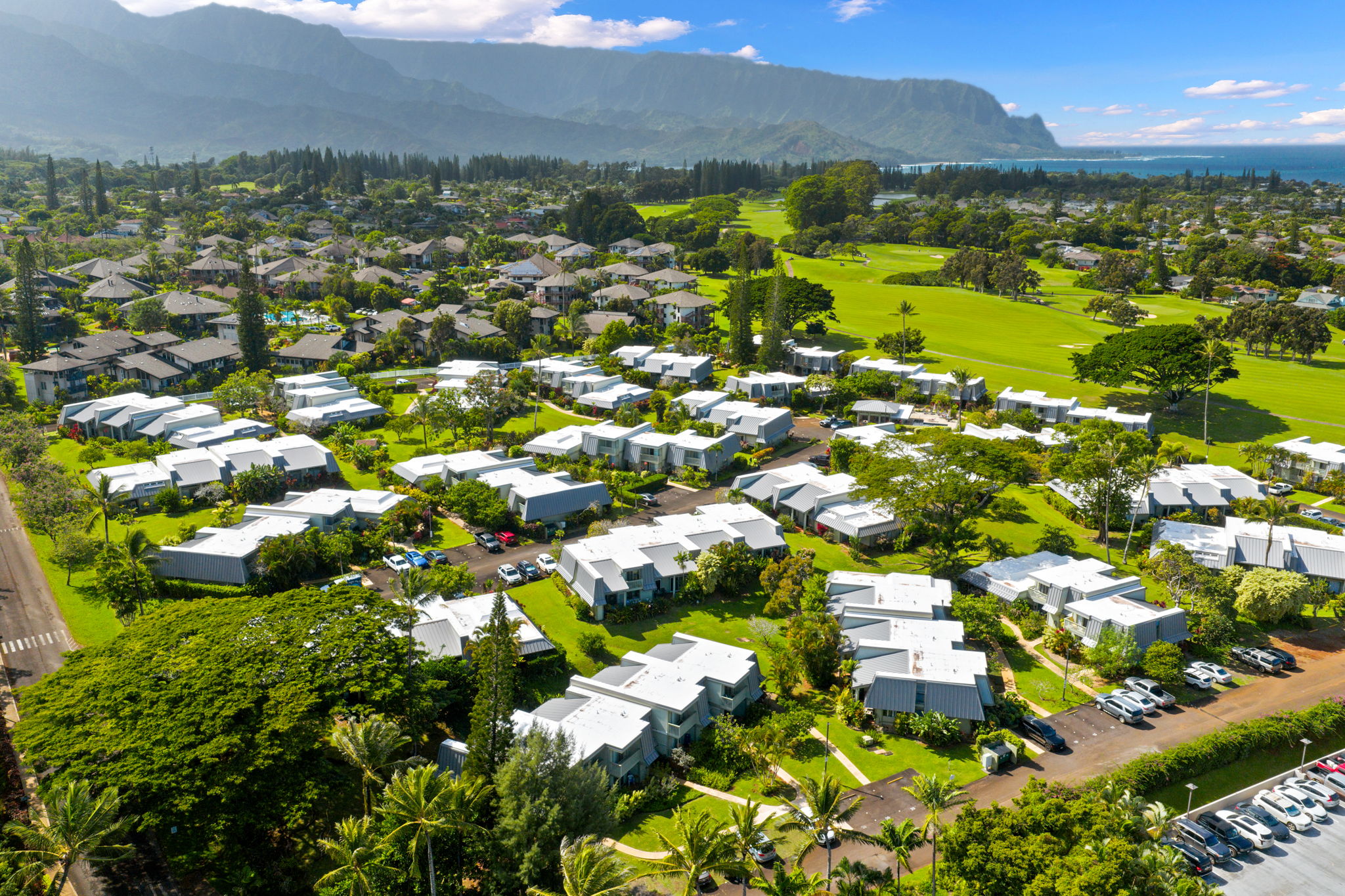 3880 Wyllie Road, Unit 20A Princeville, HI 96722 - Photo 9 of 28 a view of a city with mountains in the background