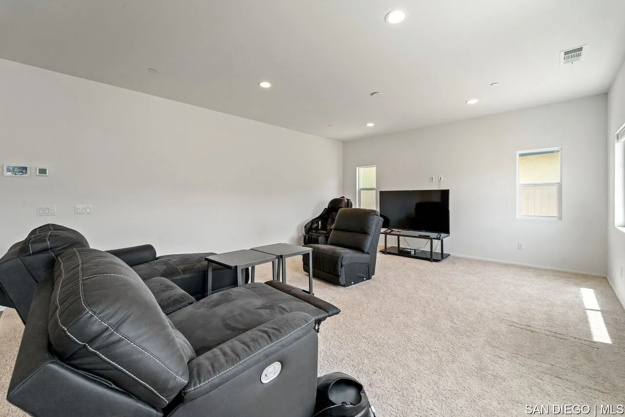 35858 Esperia Way Fallbrook, CA 92028 - Photo 13 of 37 a living room with furniture and a flat screen tv