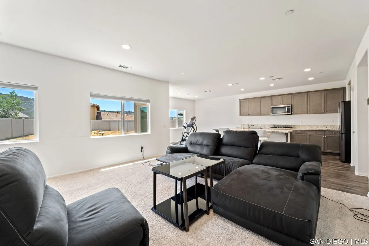 35858 Esperia Way Fallbrook, CA 92028 - Photo 15 of 37 a living room with furniture kitchen and a table