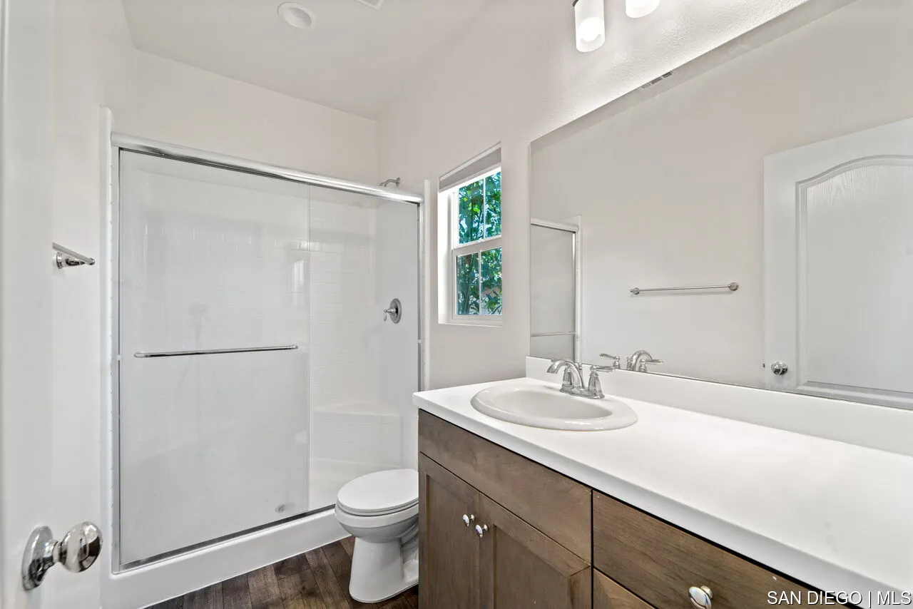 35858 Esperia Way Fallbrook, CA 92028 - Photo 18 of 37 a bathroom with a sink a toilet and shower