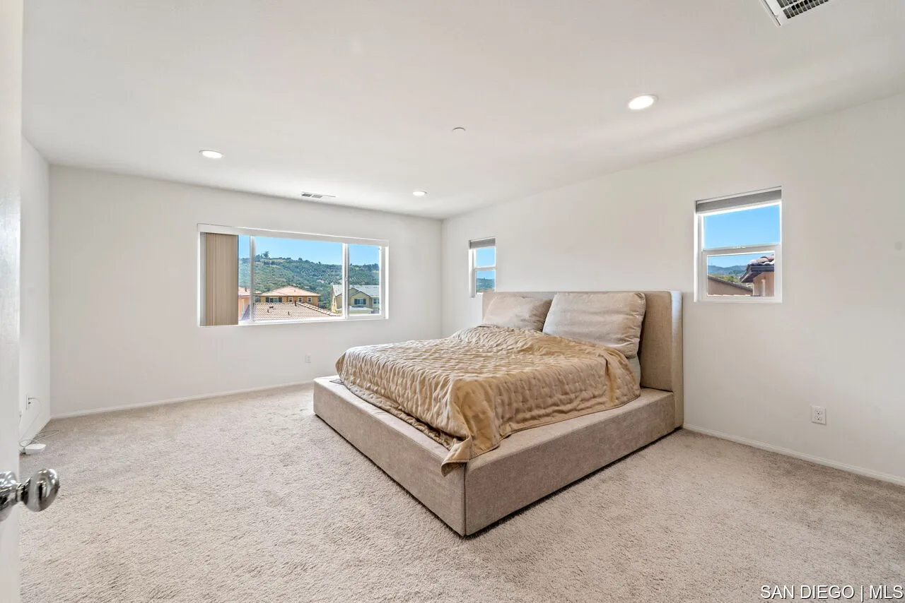 35858 Esperia Way Fallbrook, CA 92028 - Photo 19 of 37 a bedroom with a bed and wall painting