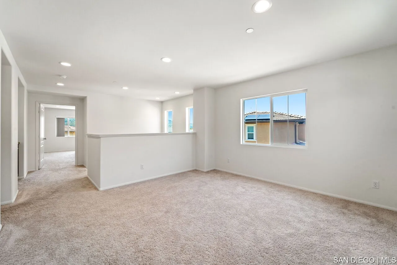 35858 Esperia Way Fallbrook, CA 92028 - Photo 25 of 37 an empty room with a empty space and windows